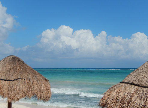 Caribbean beach with huts at the Atlantic