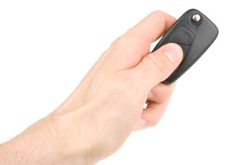 Hand holding car keys isolated on white background