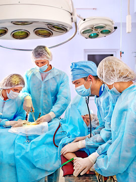 Surgeon at work in operating room.