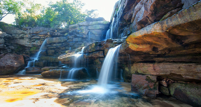 Nature landscape background of waterfall and rocks
