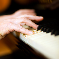 Fototapeta premium Close up of a musician playing a piano keyboard