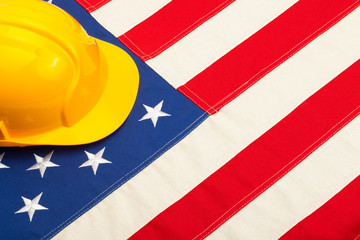 Construction helmet laying over US flag