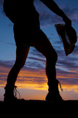 silhouette woman legs hat in hand