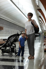 Fototapeta na wymiar Mother with son waiting train