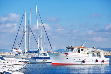 Fototapeta premium Classic white yachts in the port of Sardinia