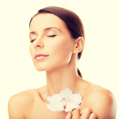 Naklejka premium relaxed woman with orhid flower
