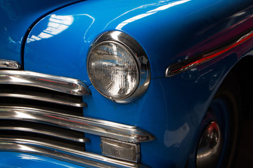 Part of an old blue car close up