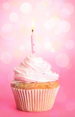 Tasty cupcake on bright background