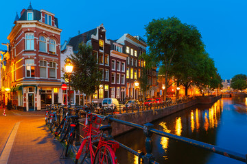 Night city view of Amsterdam canal and bridge