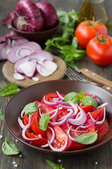 Tomato salad with sweet red onion and basil