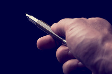 Man holding an open fountain pen