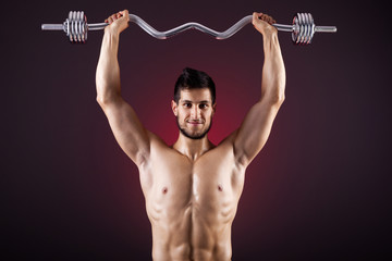 Fitness man lifting weights with curl bar