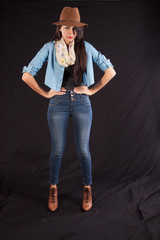 woman in brown hat standing with hands on hips