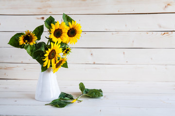 A bouquet of autumn sunflowers in a vase