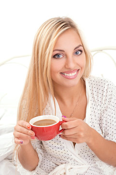 smiling attractive woman with cup of coffee