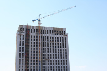 Fototapeta na wymiar Cranes and building construction