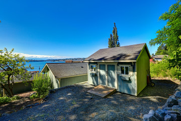 Wooden shed with white trim. Backayrd with beautiful bay view. P