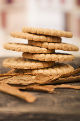 pile of delicious vanilla cookies surrounded by cinnamon sticks