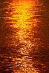 golden shimmering Sea Water with wave,Sun light refection on sea