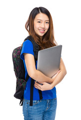 Woman student with backpack and laptop