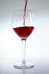 Red wine poured in a glass