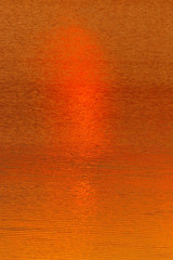 Fototapeta premium Abstract water surface with patches of sunlight.