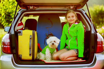 Travel - girl with dog ready for the travel for vacation