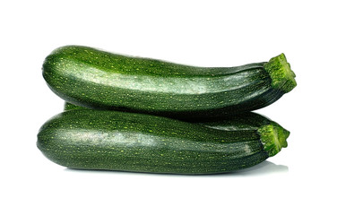 fresh green zucchini isolated on white background