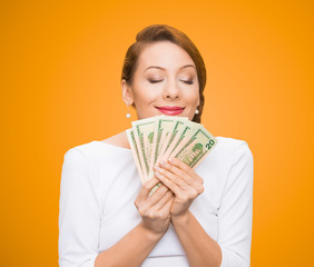 Woman loves money isolated on orange background 