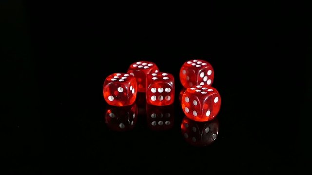 Throwing red dice on a black background. 2 pack. Slow motion. - Powered by Adobe