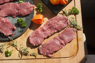 Sirloin on a cutting board, and a stoneplate