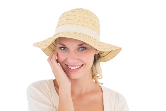 Attractive young woman wearing sun hat