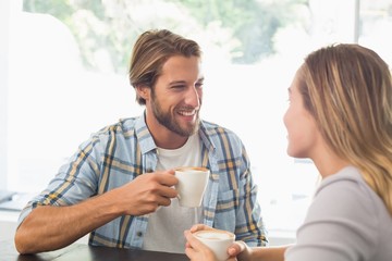 Happy couple enjoying a coffee