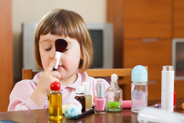 cute girl playing with makeup