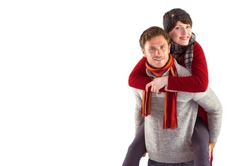 Man giving girlfriend piggy back