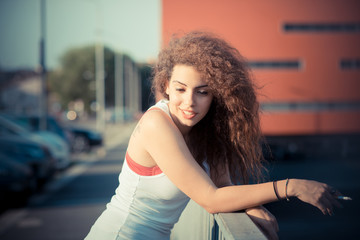 Fototapeta na wymiar young beautiful long curly hair hipster woman