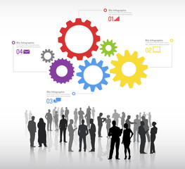 Silhouettes Of Business People Discussing And Multicolored Gears