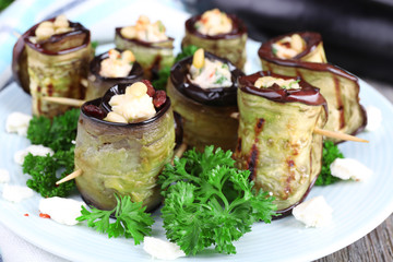Fried aubergine with cottage cheese in a round plate