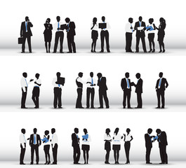 Silhouettes of Business People Working in a Row