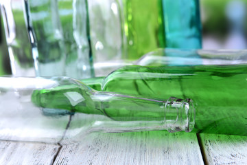 Empty glass bottles on table close-up