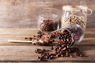 Glass jars and spoon with coffee beans