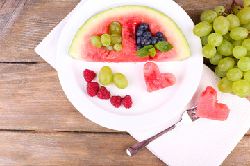Fresh juicy watermelon slice  with cut out heart shape, filled