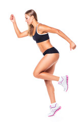 Fototapeta premium Young athletic girl on white
