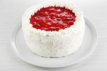 White cake on bright background close-up