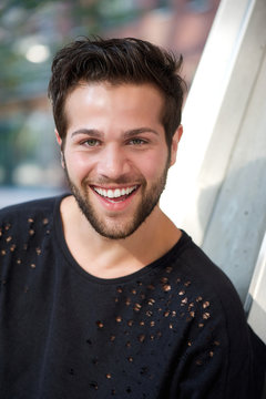 Smiling young man with beard