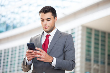 Fototapeta premium Man using his mobile phone