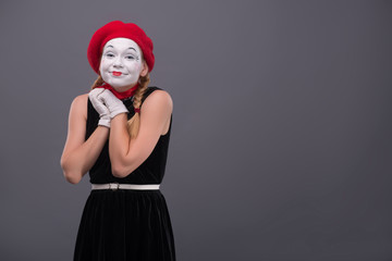 Portrait of female mime with white funny face