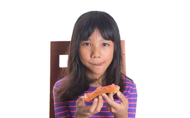 Young Malay Asian preteen girl having breakfast 