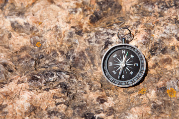 Compass on a stone background
