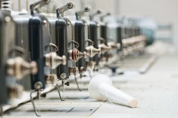 Foto op Aluminium Abandoned industrial textile machines in a row © samopauser